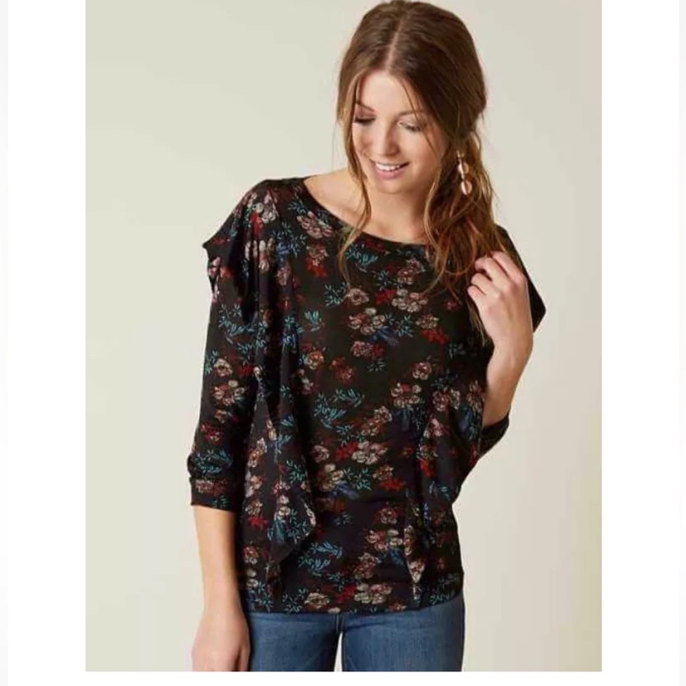 Free People Dock Street black floral ruffle blouse.